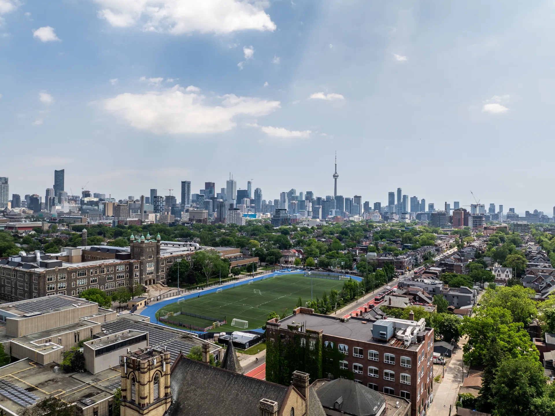 Aerial view of the proposed Central Tech Stadium turf field with the Toronto skyline and CN Tower behind it