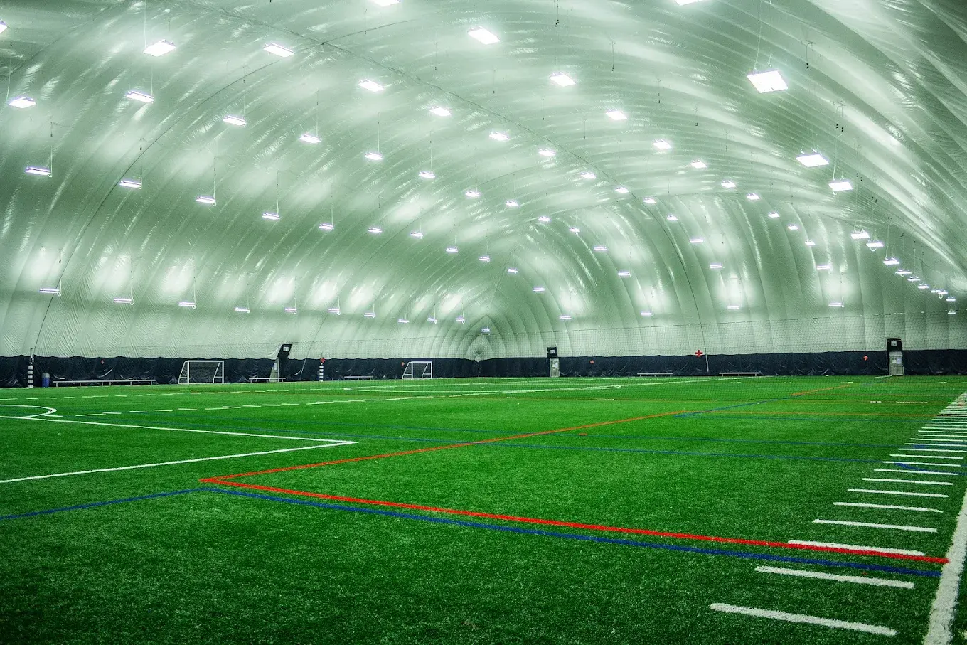 Inside the proposed Central Tech Stadium winter dome, a lit indoor turf field